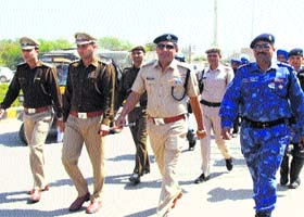The police conduct a flag march as part of a routine security exercise in Gurgaon on Friday