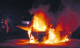 Up in Flames: A car that caught fire at NH-8 near the Delhi-Gurgaon toll plaza on Thursday night
