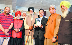 Jagdev Singh Jassowal (fourth from right) during a function to release his documentary at the Punjab Virasat Bhawan in Ludhiana on Friday. Photo: Inderjeet Verma