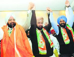 Former Chief Minister Capt Amarinder Singh (centre) with his brother Malwinder Singh (left), who rejoined the Congress, at a press meet in Chandigarh on Friday. 