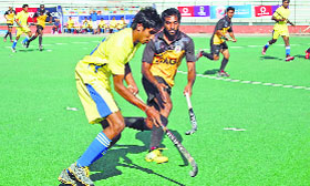 SAI (in yellow) and Comptroller & Auditor General of India players in action during the Hockey Nationals.