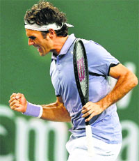 Roger Federer celebrates after winning the first set against Kevin Anderson at the Indian Wells.