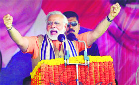 BJPs PM candidate Narendra Modi addresses an election rally in Sambalpur, Odisha, on Friday.