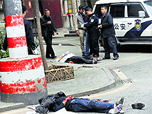Bodies lie at a crime scene after a man hacked five persons to death in Hunan province on Friday. The attacker was shot dead