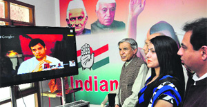 Congress vice-president Rahul Gandhi talks to party candidate Pawan Kumar Bansal and other party leaders and workers through video conferencing at the Congress Bhawan, Sector 35, Chandigarh, on Saturday. 