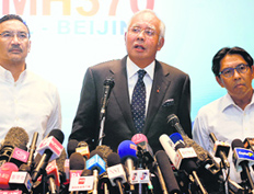 Malaysian PM Najib Razak (C) addresses mediapersons in Kuala Lumpur on Saturday.