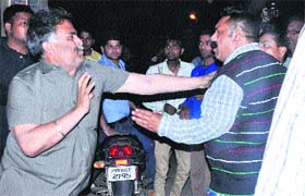 Former BJP councillor Kamal Sharma having a fight with the supporters of Akali leader Manjit Singh Titu at Model House in Jalandhar on Friday night