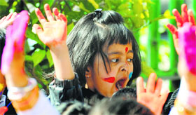 Holi splash: Children take part in the Holi celebrations at ABC Montessori School.