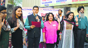 Artists of Ishmeet Academy and district administration officials urge youngsters to cast vote on April 30.