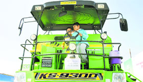 Children have a fun time on a harvester displayed at the Kisan Mela in Ludhiana.