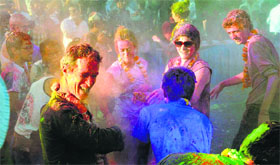 Riot of colour Foreign tourists celebrate Holi in Jodhpur on Saturday.