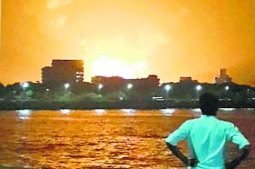 INS Sindhurakshak on fire in Mumbai on August 13, 2013. An explosion on the submarine killed crew members
