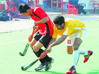 Uttar Pradesh (in red) beat Karnataka 2-1 in their match of the National Championship (Division A) on Saturday. Tribune Photo