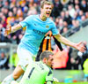 Manchester City's Edin Dzeko celebrates after scoring a goal against Hull City in their EPL match on Saturday. Reuters