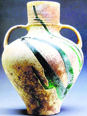Jar. Unglazed earthenware with splashes of green glaze. Syria, 8th century. The al-Sabah collection, Kuwait