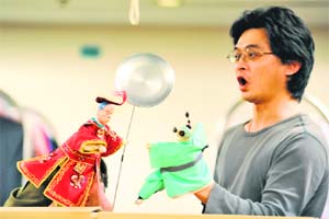 Performers control hand puppets during a rehearsal at the Experimental Theatre in Taipei