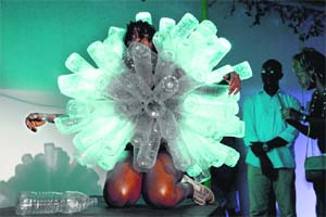 Ivorian dancer Nadia Beugre performs on stage wearing plastic bottles during the African Performing Arts Market festival at the Goethe Institute in Abidjan