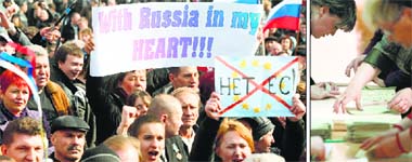 Pro-Russian activists hold a rally in Ukrainian city of Donetsk on Saturday; and election commission officials count ballots ahead a referendum at a polling station in the Crimean town of Simferopol