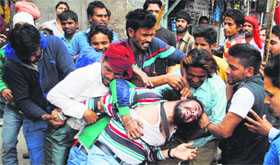 Jasmeet Singh being thrashed by youths on Saturday.