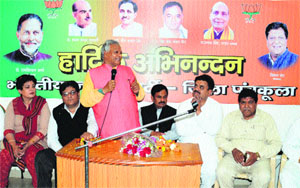 BJP-HJC nominee Ratan Lal Kataria addresses a meet of party workers in Panchkula on Sunday. 