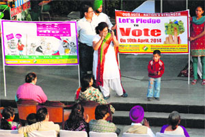 Residents attend a musical evening organised to encourage them to vote at Sukhna Lake in Chandigarh on Sunday.