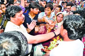 The DSP tries to pacify the protesters in Rohtak on Sunday