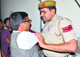 A policeman argues with an activist