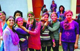 Students of Government College play Holi on the college campus in Dharamsala on Saturday