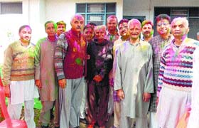 Elderly people play with colours on Holi in Kangra on Sunday