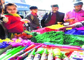 A roadside vendor sells water guns with the picture of BJP's prime ministerial candidate Narendra Modi on these in Shimla on Sunday