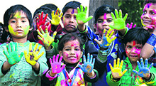 Students of Kids Paradise School play Holi with special children of Pingla Ghar in Jalandhar