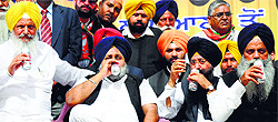 Sukhbir Singh Badal and other Akali leaders have Diet Coke during a rally held in favour of Manpreet Singh Ayali in Ludhiana