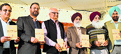 Officials release a book in Ludhiana on Sunday