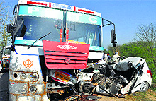 The mangled remains of a car and a bus that collided in Banur near Patiala on Sunday