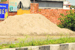 A heap of sand dumped on the roadside in Amritsar