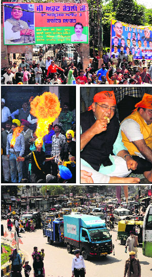 Hoardings put up by the ruling alliance to welcome Arun Jaitley in Amritsar on Tuesday. (Middle) Sikh youth perform fireworks during the roadshow (and right) Arun Jaitley partakes of 'langar' at Golden Temple. (Bottom) The city witnessed a huge traffic jam during senior BJP leader Arun Jaitley's roadshow.