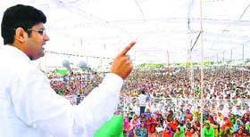 INLD candidate Dushyant Chautala addresses a rally in Hisar on Tuesday