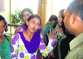 A girl argues with a policeman at Chaudhary Devi Lal University in Sirsa on Tuesday