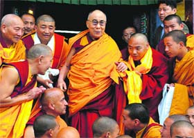 The Dalai Lama with his followers on his arrival at the main Buddhist Monastery, Sanjauli, in Shimla on Tuesday