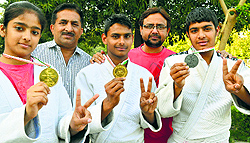 Back in Ludhiana, local judo players show the medals they won at the National Rural Sports Festival in Ranchi