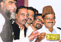 AAP chief Arvind Kejriwal with Muslim leaders during a conference in Delhi on Tuesday. Tribune photo: Mukesh Aggarwal