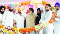 Chief Minister Parkash Singh Badal with SAD candidate Sher Singh Ghubaya at a rally in Ferozepur on Tuesday. Tribune photo