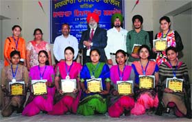 Students strike a pose with chief guest Dr SS Gill, Vice-Chancellor of the Baba Farid University of Health Sciences, during the annual prize distribution function at Government Rajindra College in Bathinda on Wednesday