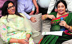 BSP nominee Jannat Jahan and BJPs Kirron Kher share a light moment during a break in the open debate