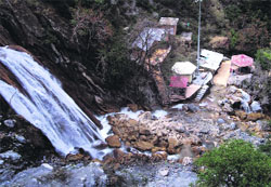 The mud and stone debris strewn at Kempty Falls, near Mussoorie, poses a threat to tourists. a tribune photograph