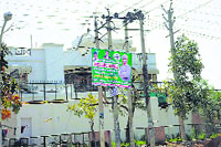 A poster of a political party hangs outside a house in the Old Faridabad market. Photo: Rakesh Kashyap