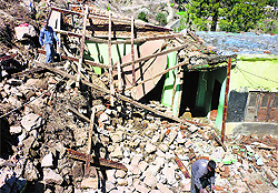 A house damaged by the recent rain in Paranoo village of Doda district