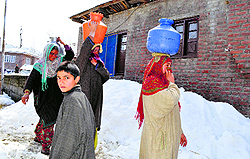 Women of south Kashmirs Damhal Hanjipora area of Kulgam district have to fetch water from far-off rural areas
