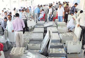 Poll officials check electronic voting machines in Bhopal on Wednesday