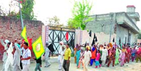 BKU and labour activists take out a rally in Himmatpura village in Moga on Wednesday